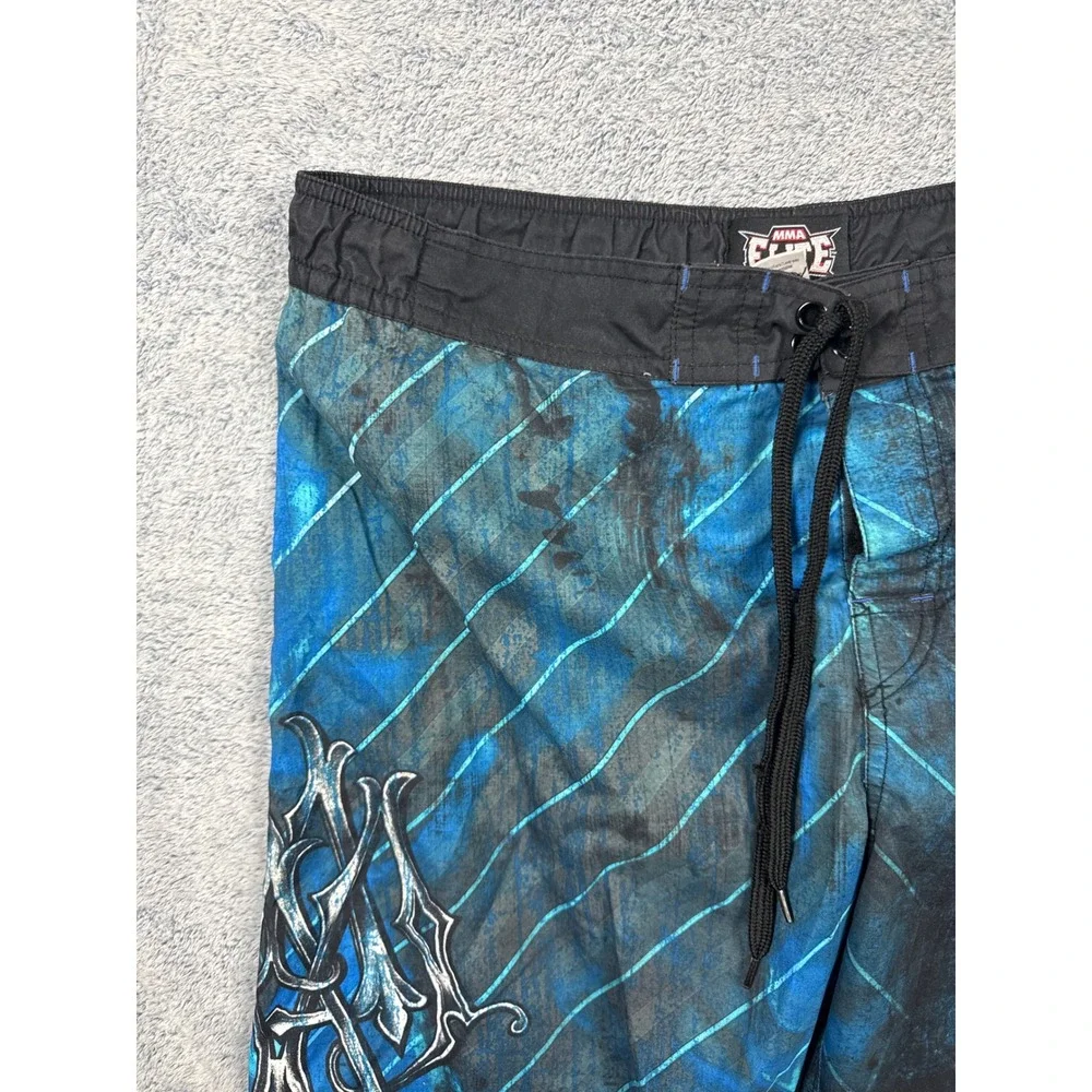 MMA Elite Mens Size M Blue Board Shorts Graphic Cross Wing Swim Trunks